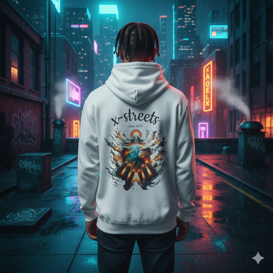 Rear view of a person with dreadlocks wearing a white hoodie with a vibrant backprint of hands holding a glowing earth surrounded by smoke and the text 'x-streets since 2025'. The person stands in a rainy, neon-lit cyberpunk alleyway with graffiti-covered walls and distant city buildings, creating a modern streetwear aesthetic.