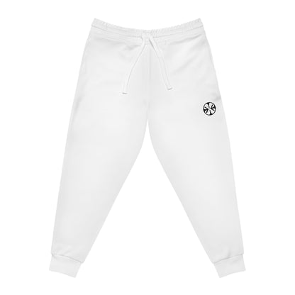 White athletic joggers by x-streets with bold “RISK” leg print – tapered unisex fit, sublimation print, made for fearless streetwear statements.